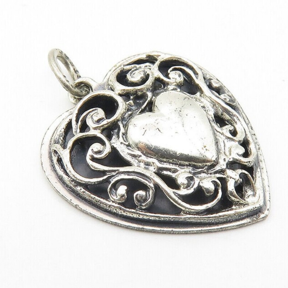 Beau sterling silver charm pendant